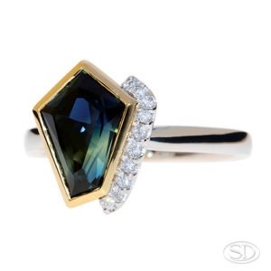 asymmetrical cut, Australian-sapphire ring with diamonds down one side, two-third view