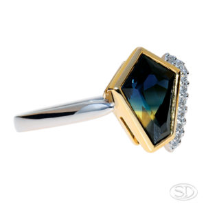 asymmetrical cut, Australian-sapphire ring with diamonds down one side, two-third view