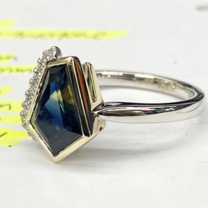 asymmetrical cut, Australian-sapphire ring with diamonds down one side, two-third view