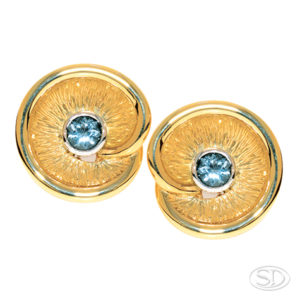 custom made & designed Ceylonese blue sapphire earrings with spiral motif in yellow gold